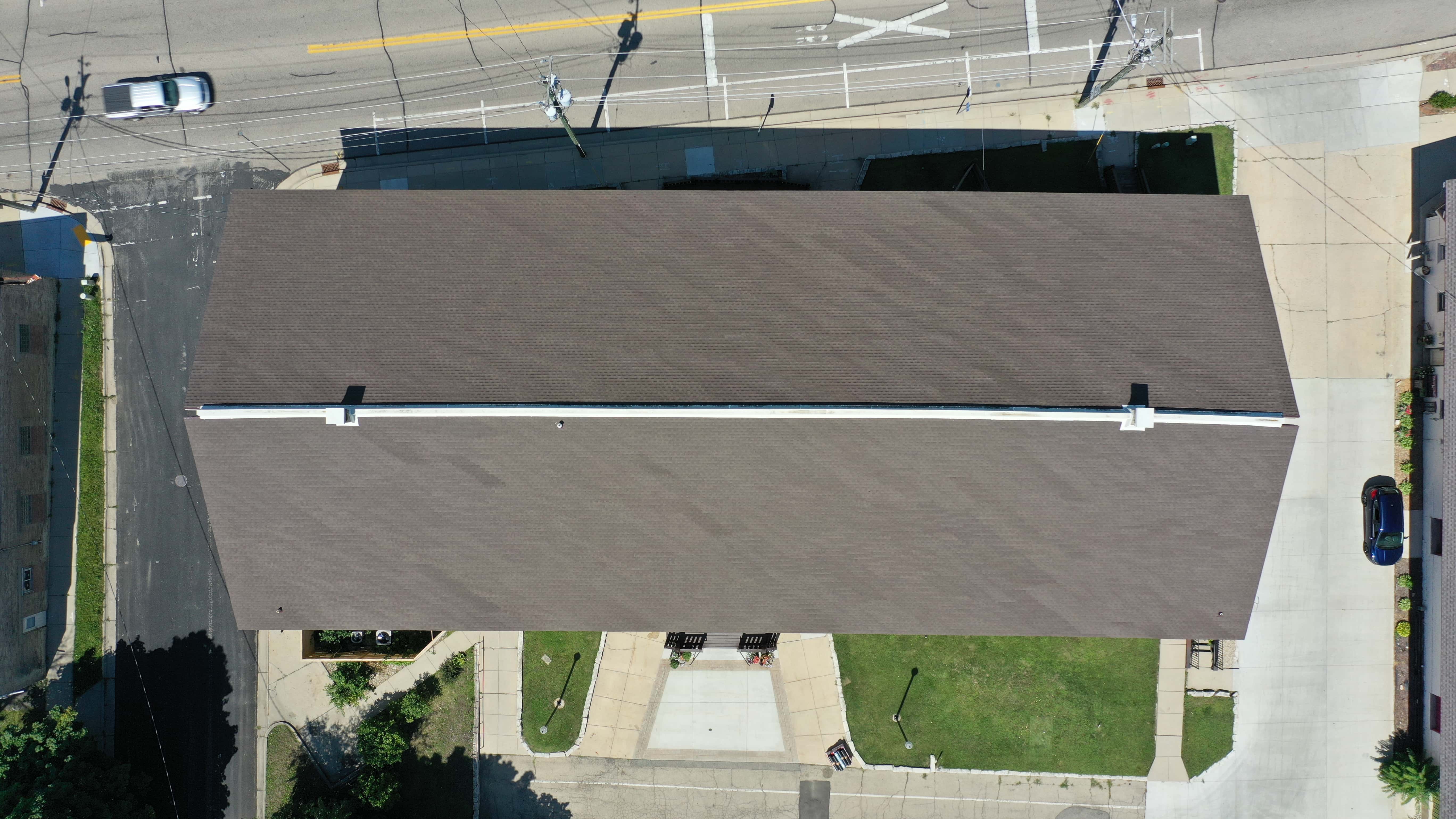 After roof replacement on wedding venue featuring new GAF shingles with clean lines and uniform finish