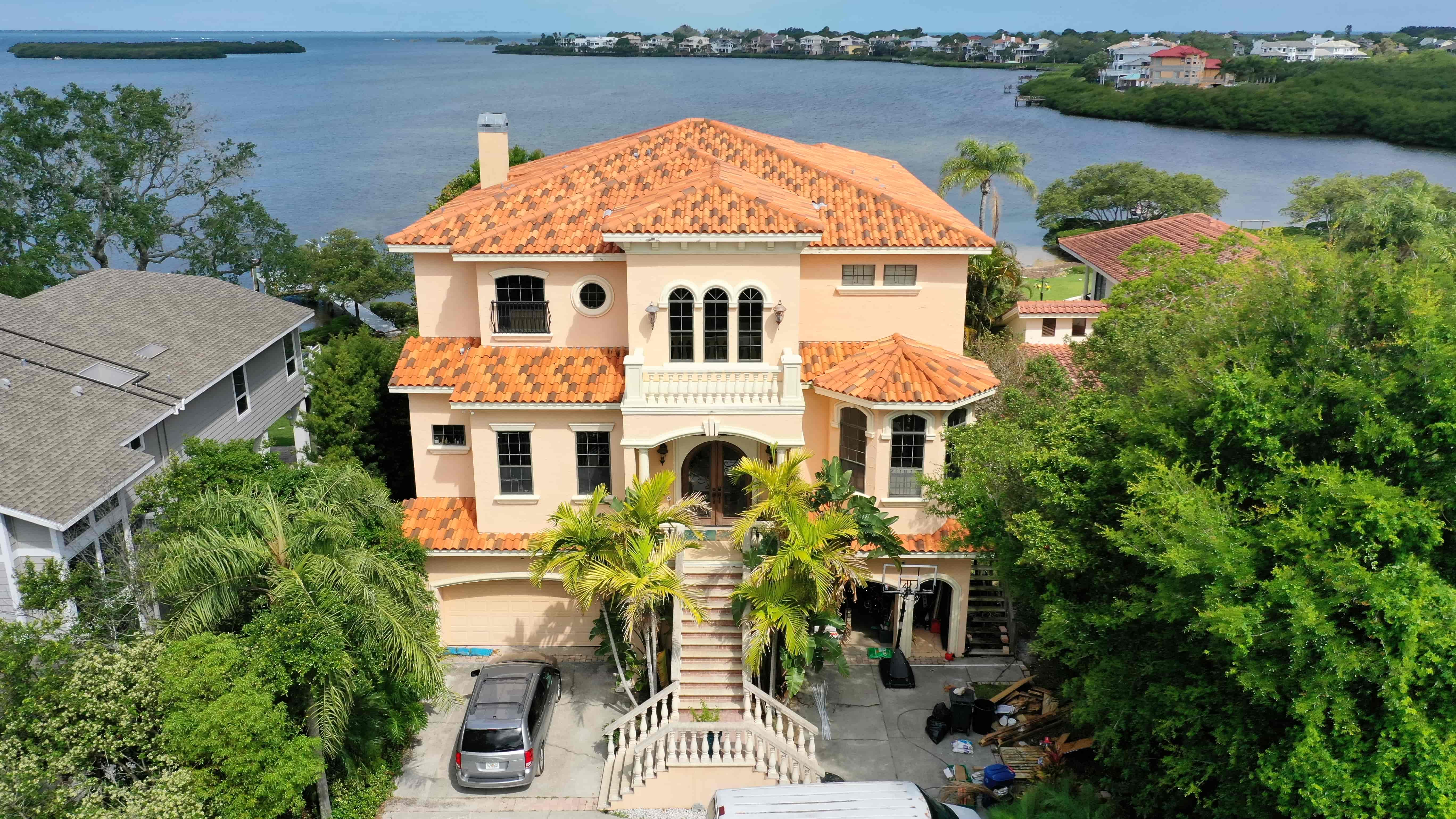 Florida home exterior transformed with Hardie siding replacing worn stucco for improved curb appeal and durability