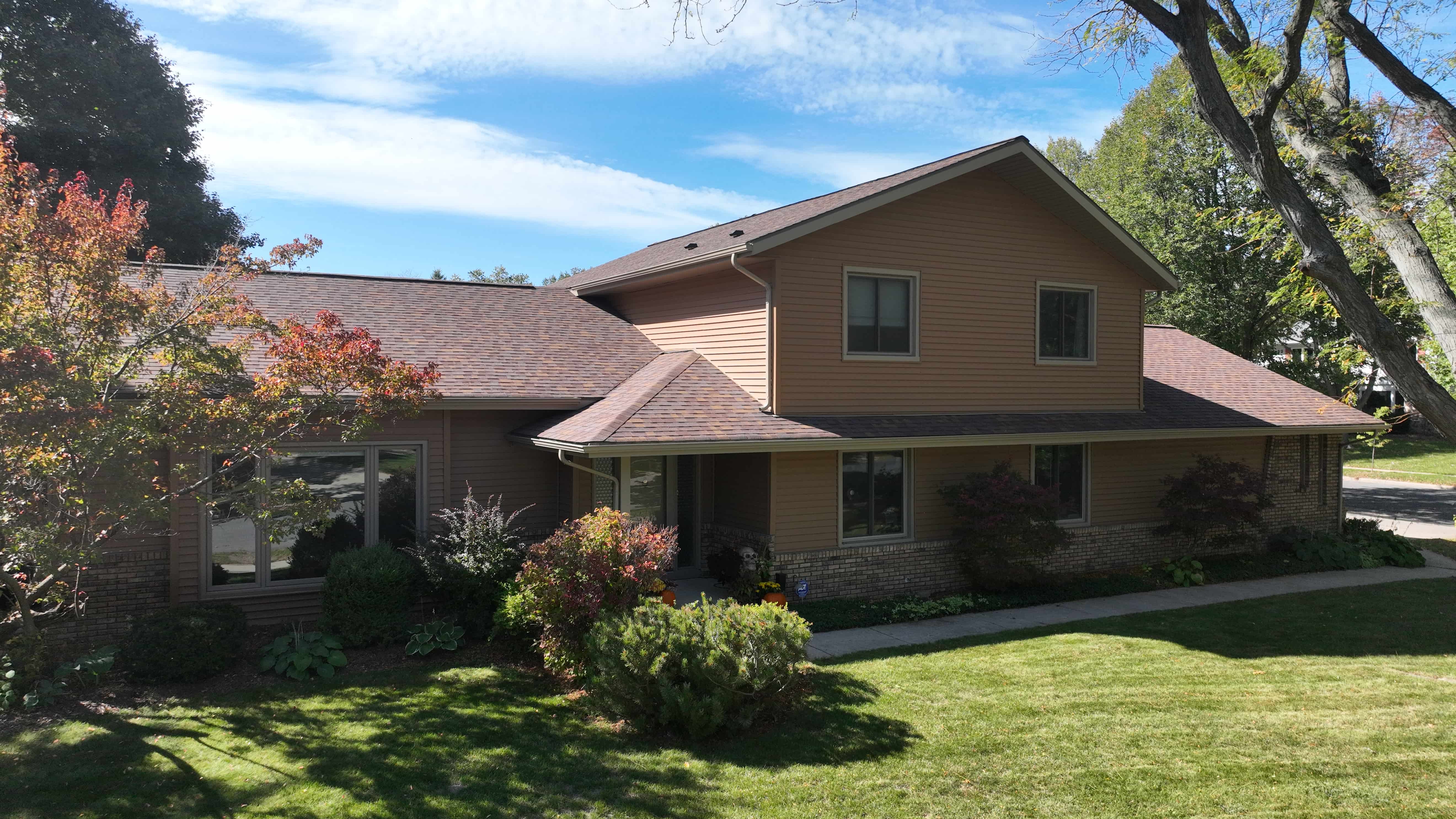 Vinyl siding transformation in Autumn Harvest color by Ridge Top Exteriors enhancing curb appeal with a subtle exterior upgrade