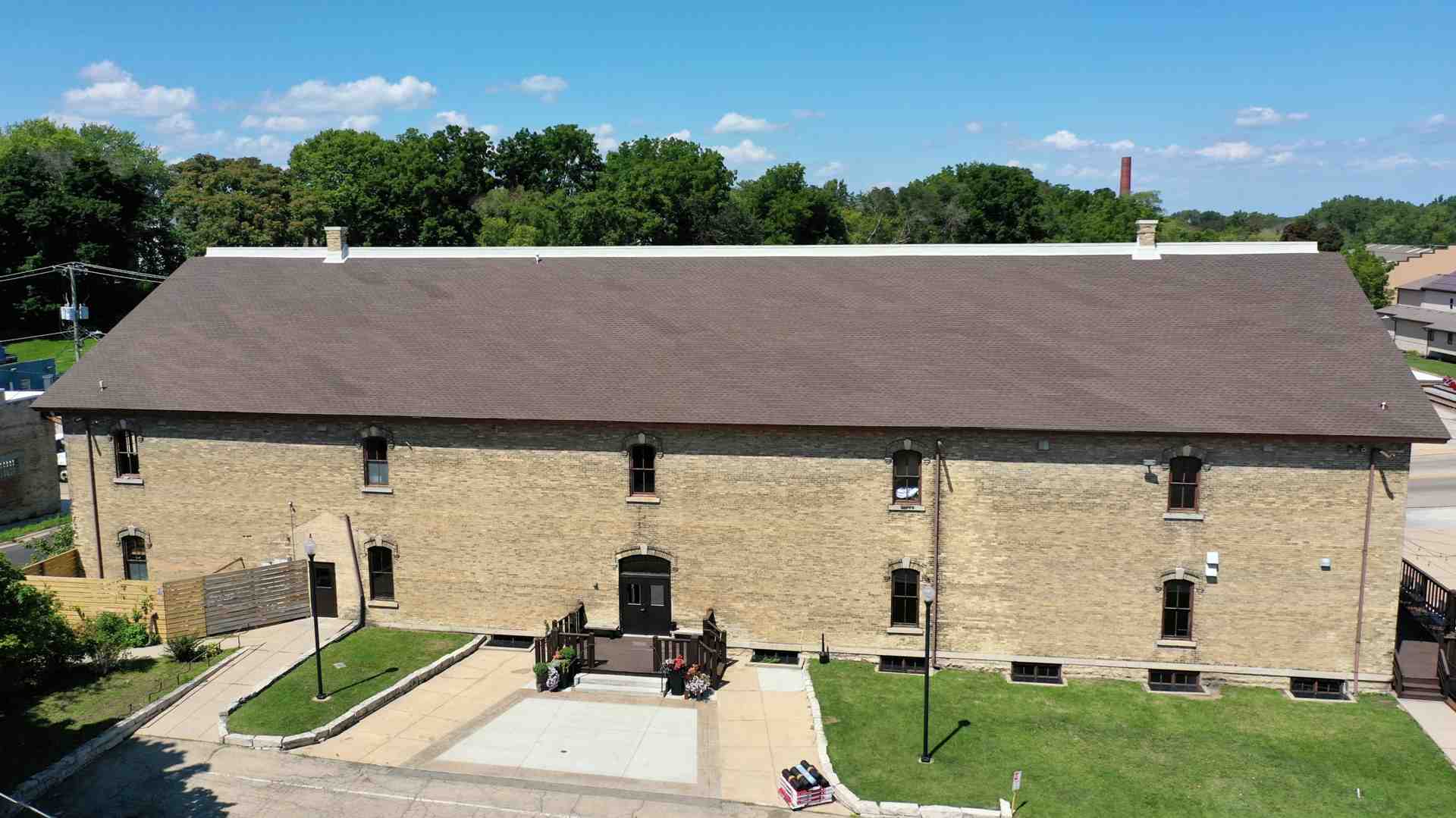 commercial building with GAF asphalt shingle roof - commercial roofing Wauwatosa
