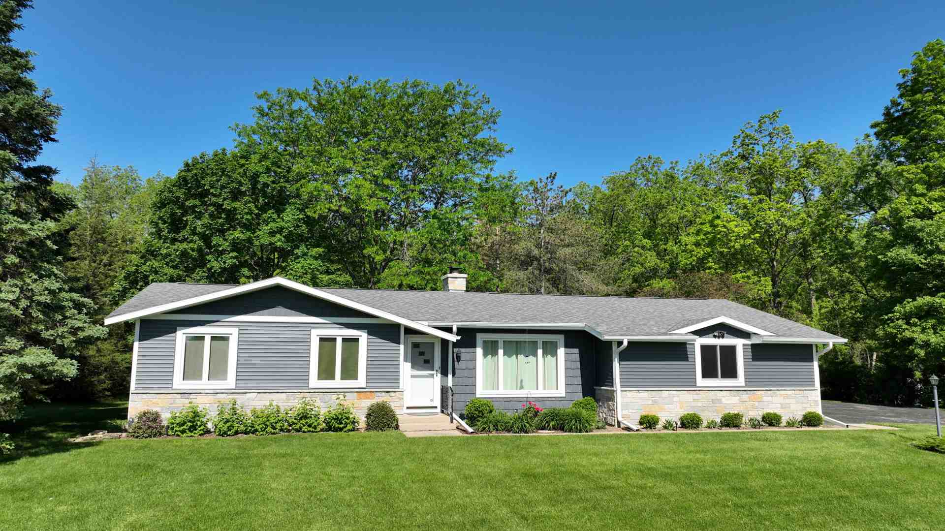 new vinyl siding on suburban home - New Vinyl Siding Cost