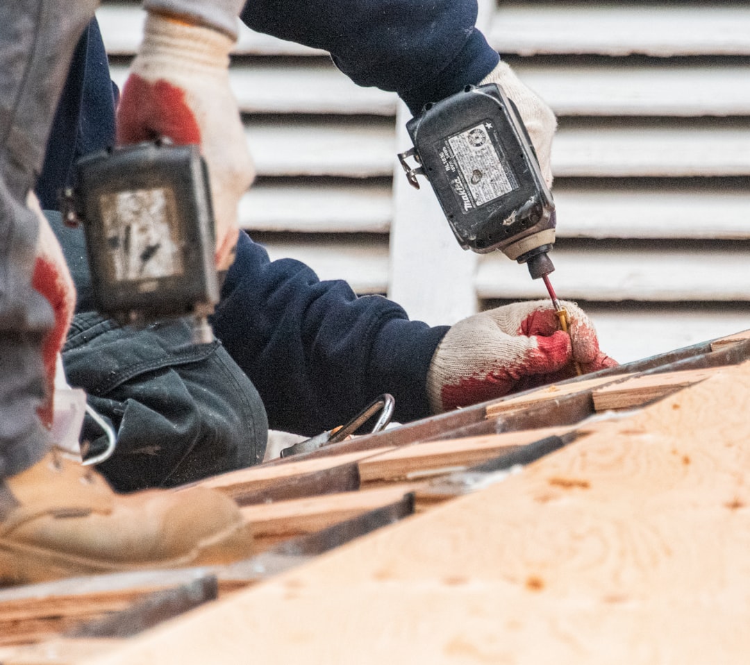 A factory-certified roofing crew installing shingles with precision - Roofing Cedar Rapids